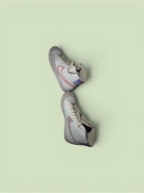 Nike White High-Top Sneakers with Pink Swoosh Accent